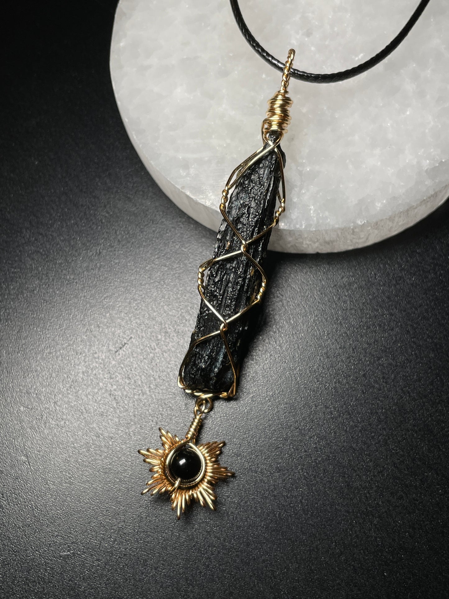 Tektite with sun pendant