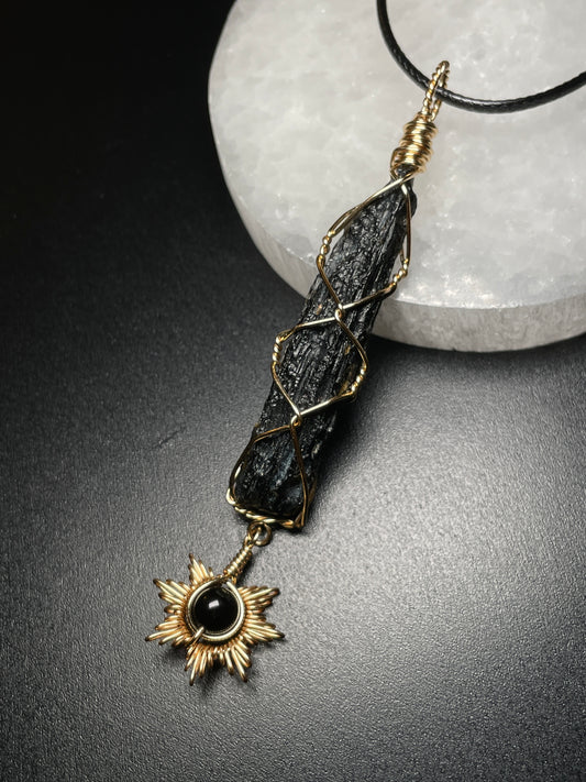 Tektite with sun pendant
