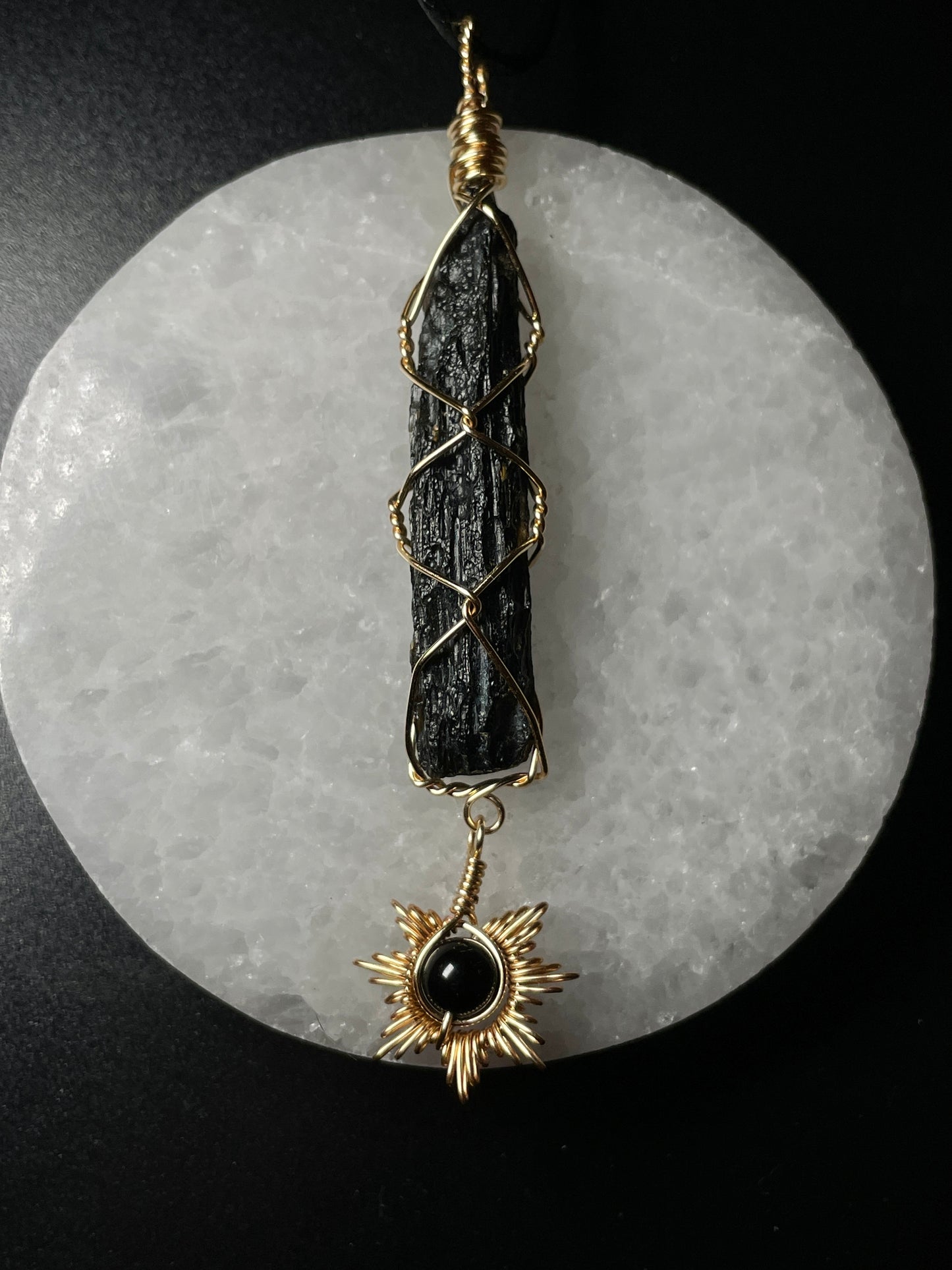 Tektite with sun pendant