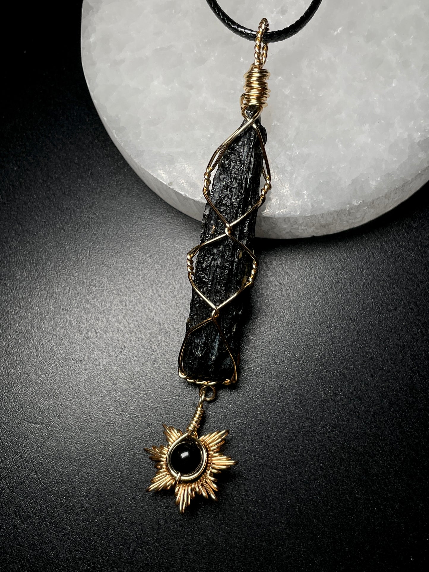 Tektite with sun pendant