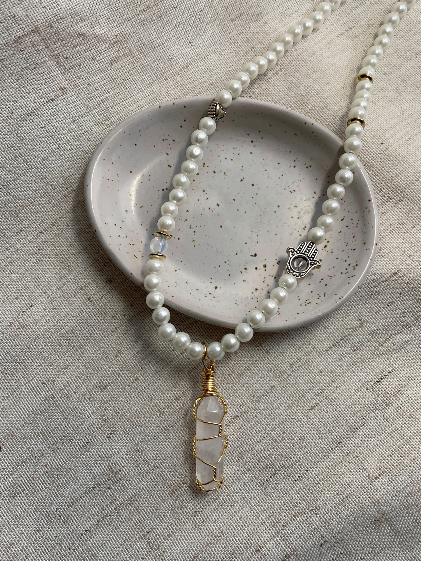 Faux pearl necklace with crystal pendant