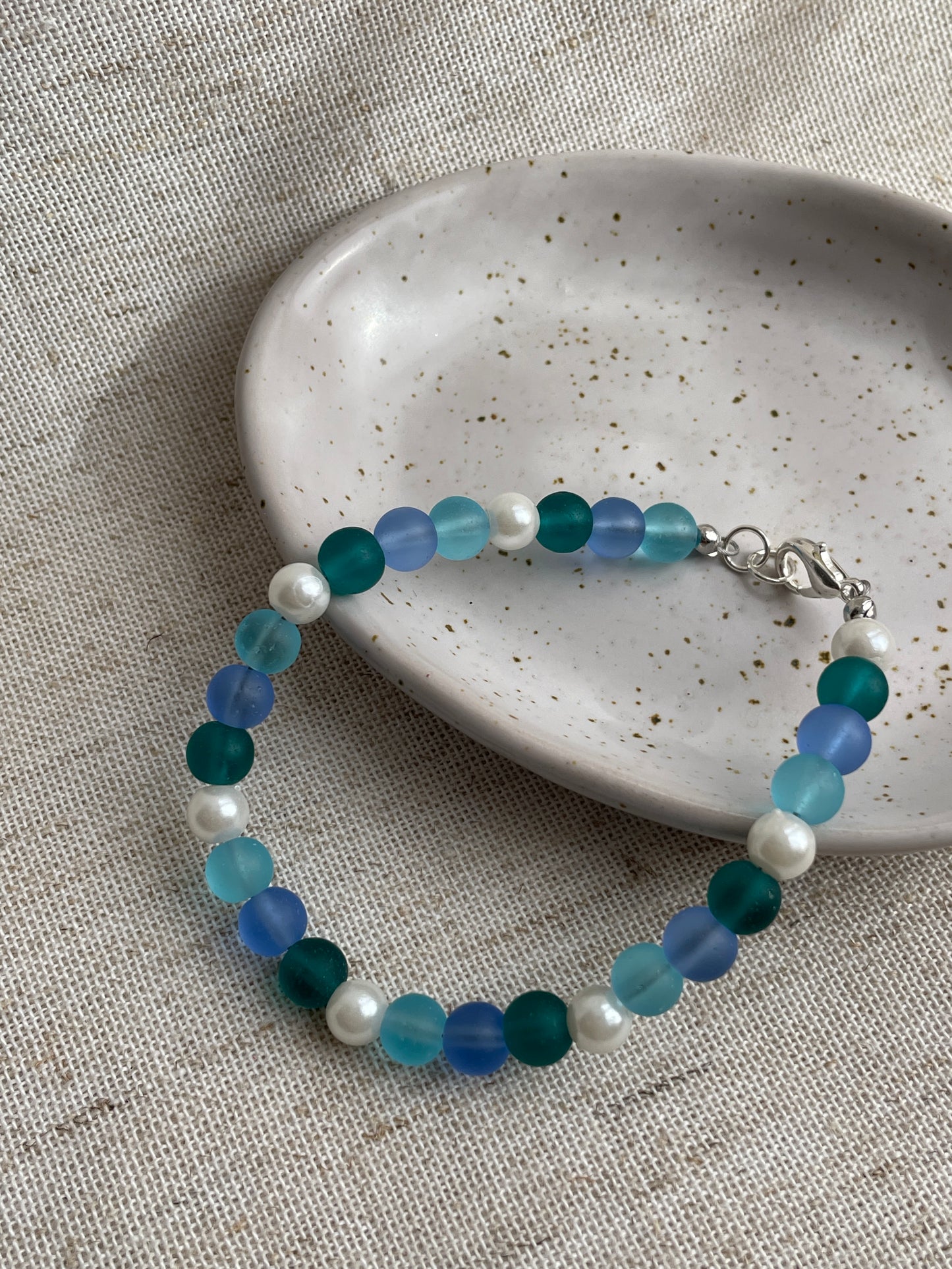 Sea glass bracelet with charms