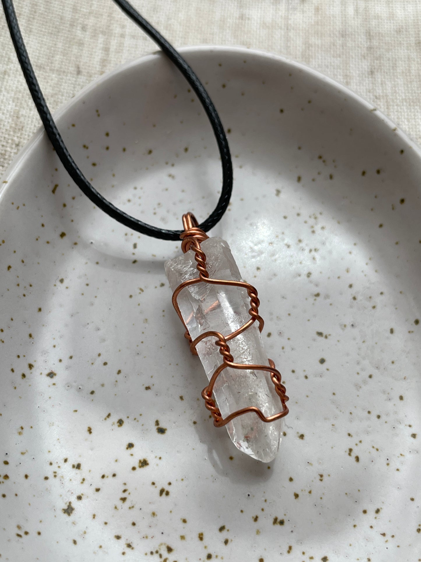 Raw clear quartz pendant