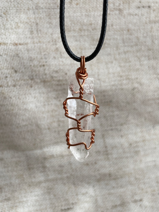 Raw clear quartz pendant