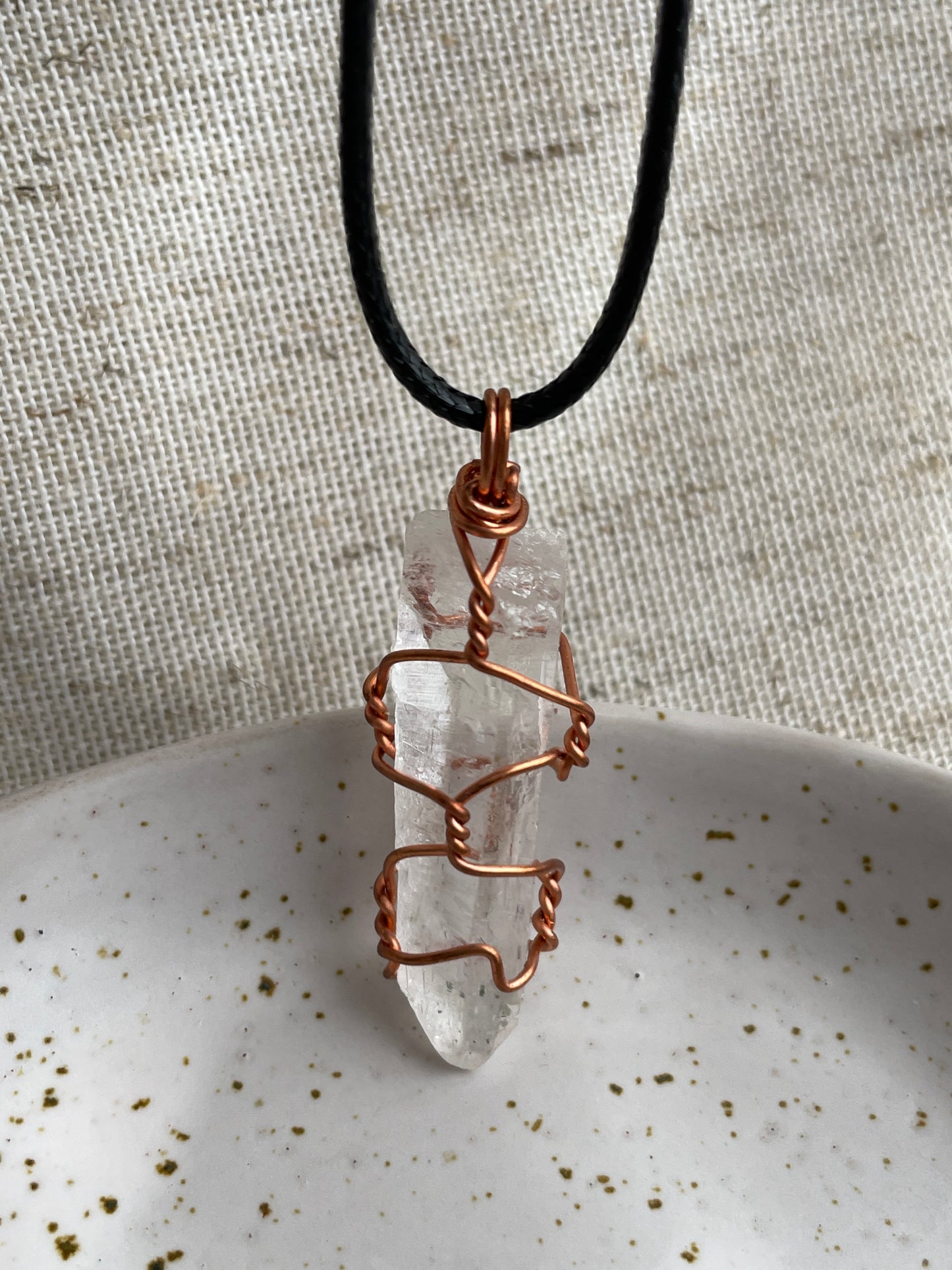 Raw clear quartz pendant