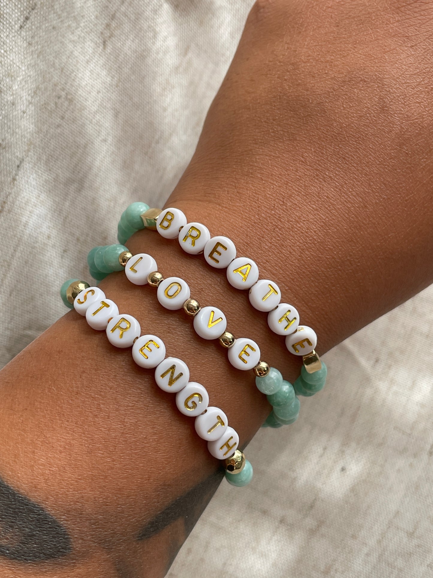 Motivational gemstone bracelets