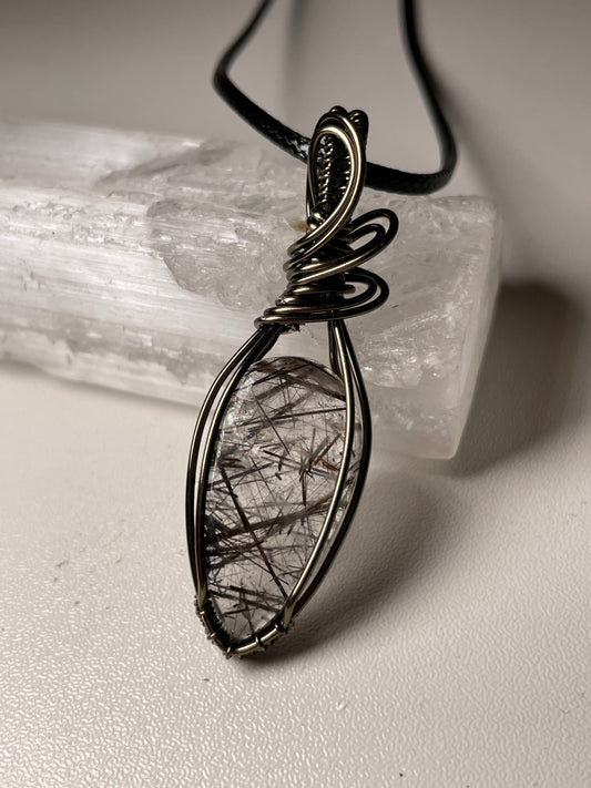 Dark rutile quartz pendant (hematite)