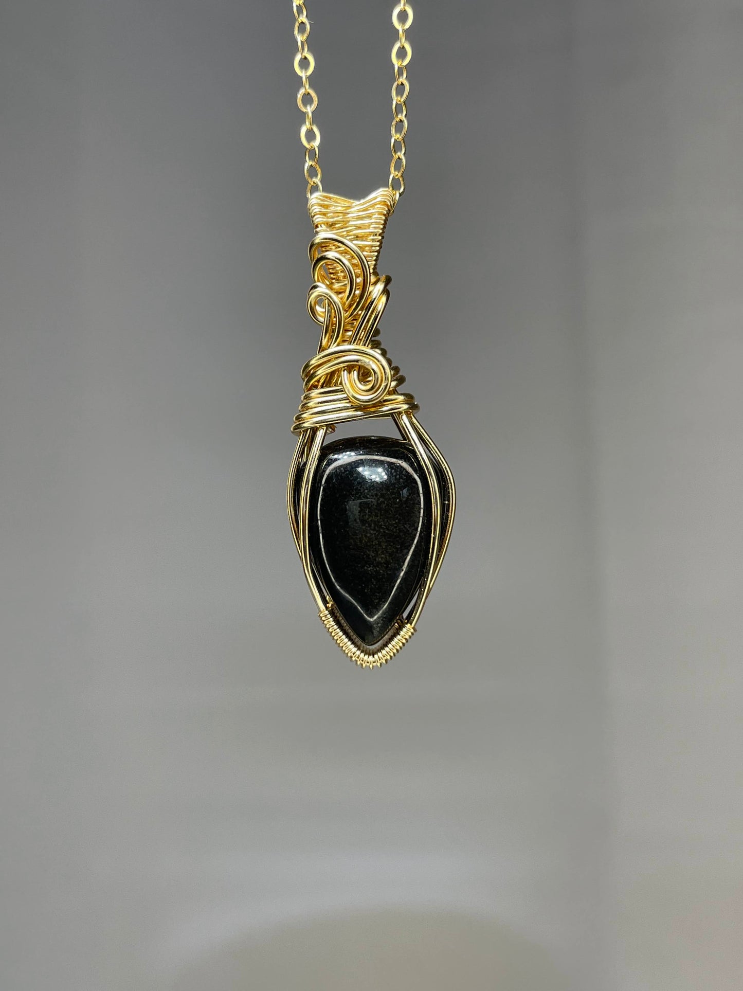 Gold sheen obsidian pendant